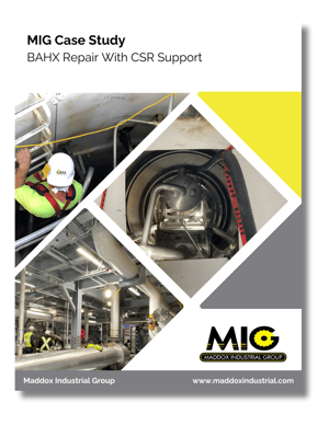 Technicians removing a worn BAHX core from an industrial facility